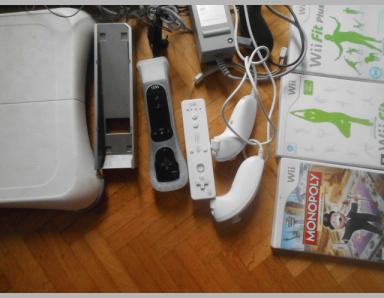 Wii avec tous ses accessoires et 8 cd de jeux - photo 0