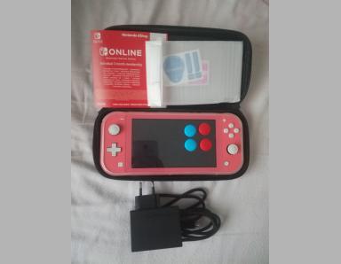 Console switch lite corail avec 4 accessoires et abonnement - photo 0