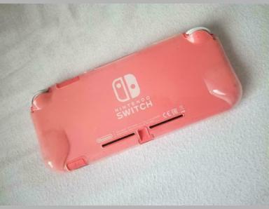 Console switch lite corail avec 4 accessoires et abonnement - photo 1